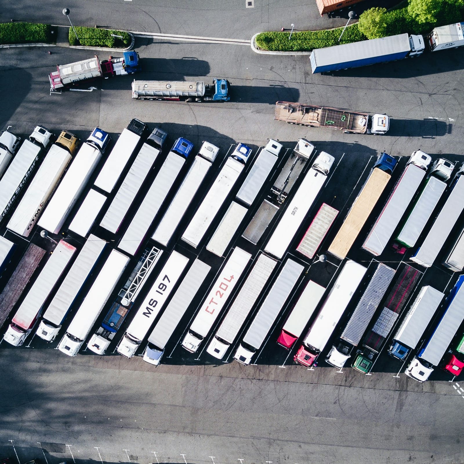 Aerial view of a large connected vehicle fleet parked in a depot